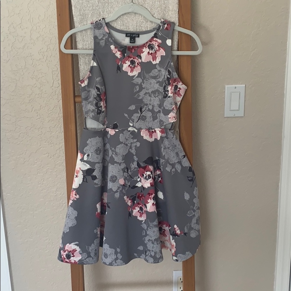 Girls dress with side cutouts.
